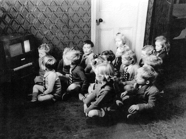 Children watch TV at Southdene School, South Shore