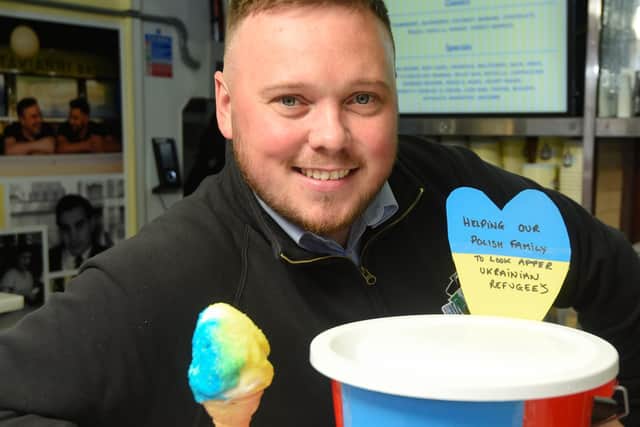 Notarianni Ices are raising money for Ukraine by selling blue and yellow ice cream packages. Pictured is Josh Johnson.