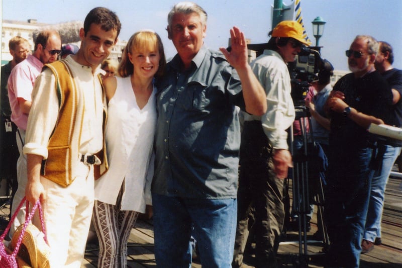 Coronation Street stars Kevin and Sally Webster with local photographer Robert McDougall during filming on North Pier Blackpool in 1994