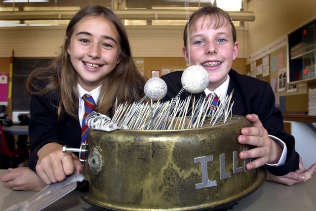 Pupils at Cardinal Allen School in Fleetwood  built several robots as prototypes for a full-scale machine to take part in the BBC programme 'Robot Wars'. Pictured with their creation 'Millenibug' are Danielle Johnson (left) and Leanne Hurst.