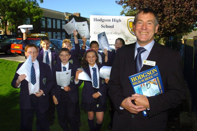 Hodgson High School, Poulton le Fylde.  Headteacher Colin Simkins and some of the pupils holding the letters telling them of their school's Ofsted success in 2005