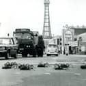 Ten giant spiders, which were starring in the BBC series at the time, stop the traffic on Blackpool Promenade as they make their way to the Dr Who Exhibition in 1974