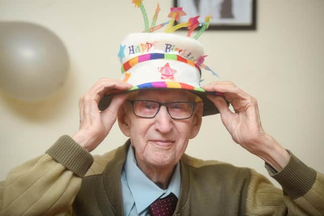 Henry Hampson celebrates his 100th birthday with family and staff from Hollins Bank Care Home in South Shore