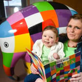Brian House Children’s Hospice has announced it is organising Elmer’s Big Parade Blackpool. 
Pictured is Natalie Ditchfield reading the Elmer book by David McKee with two-year-old daughter Taylor who was born with a serious heart condition and is supported by the hospice