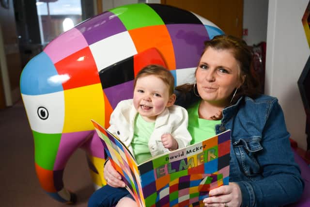 Brian House Children’s Hospice has announced it is organising Elmer’s Big Parade Blackpool. 
Pictured is Natalie Ditchfield reading the Elmer book by David McKee with two-year-old daughter Taylor who was born with a serious heart condition and is supported by the hospice