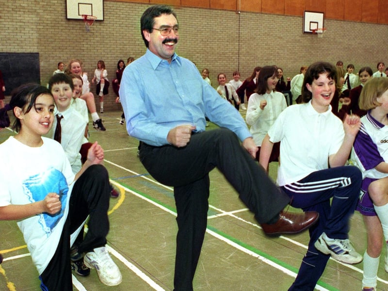 Headteacher Paul Moss struts his stuff as part of a sponsored aerobics in the sports hall at Montgomery High School. It was to raise money for Romania in 1998