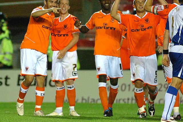 Gary Taylor-Fletcher (left) celebrates after scoring Blackpool's fourth goal