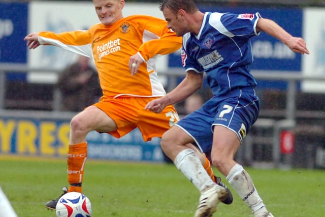 Claus Bech Jorgensen takes on former Blackpool player Richie Wellens in a match against Oldham Athletic. After retiring from the pitch, Jorgensen returned to Denmark to coach the AaB under-15 team in July 2019