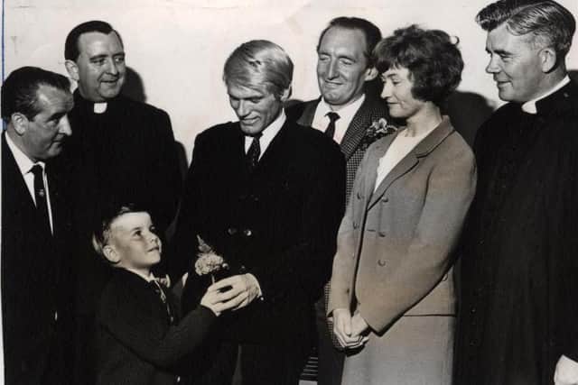 Adam Faith in 1966 when he was taking part in the season's South Pier show. He took time out to open St John Vianney Church annual garden party in the school hall, and during the ceremony, was given a button hole by Andrew Schofield