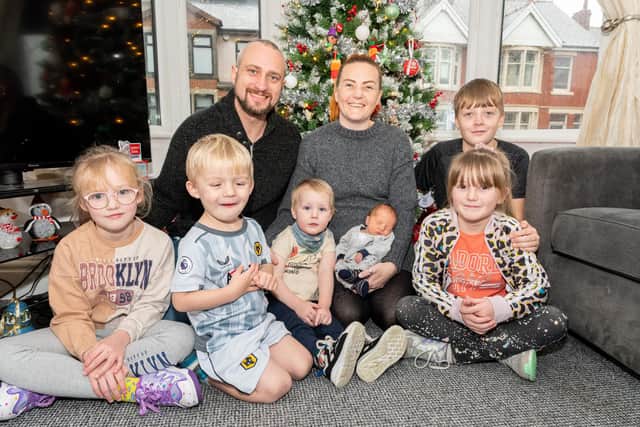 Samantha Fellows with new baby Coady-Louis, partner Chris George and  their other children (from left) Molly-Raee, Archie-Lee, Caleb, Tyler and Hope. Photo: Kelvin Stuttard