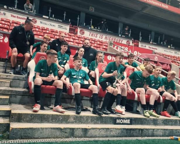Foxhall Under-14s celebrate their Coulton Cup triumph at Fleetwood Town