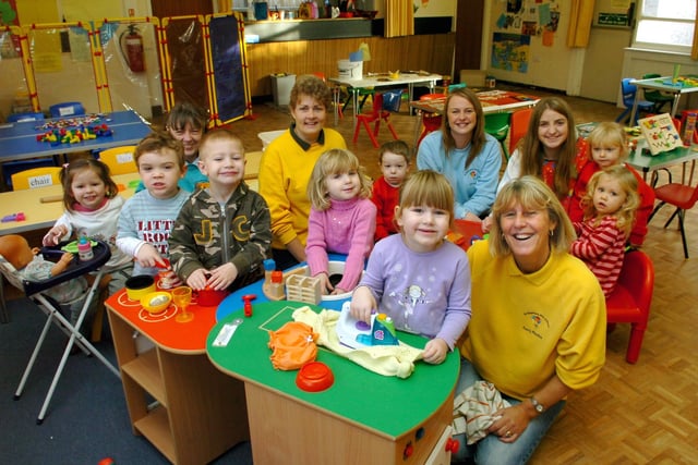 St Stephen's Pre-School supervisor Pauline Duncan (right) with some of the children and staff in the role-play area