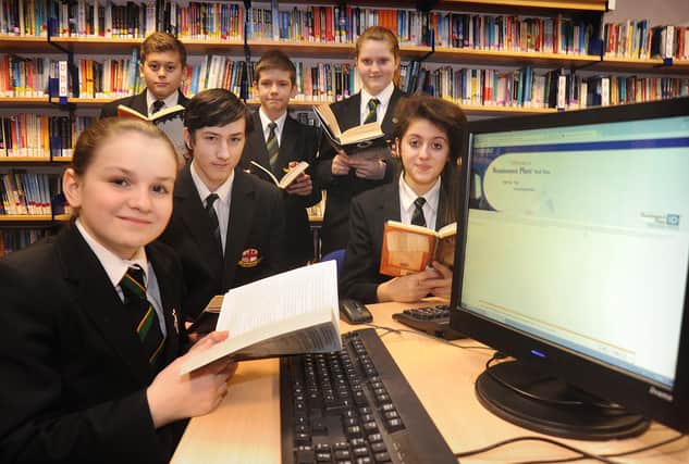 Year 8 pupils at St George's High School in Marton are trialling a new software package which provides additional tuition in English and Maths. Pictured in the library using the programme are clockwise from bottom left: Shannon Frankle, Lucas Thorpe, Reece Gibson, Mark McGregor, Chloe Hammond and Katy Shaw