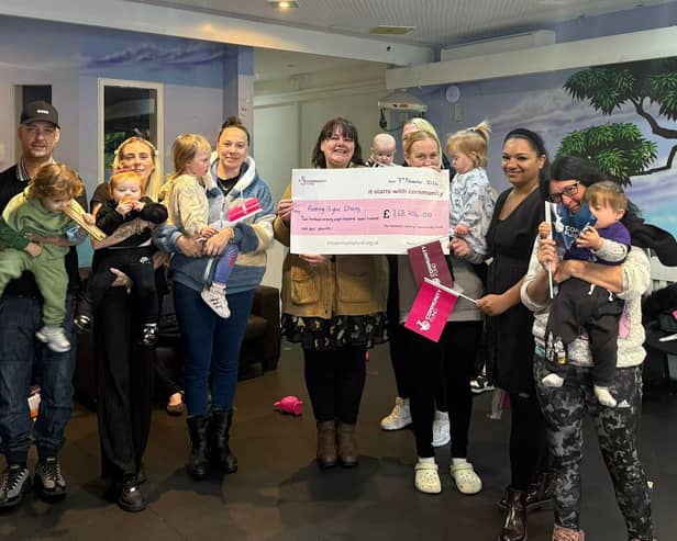 Charity Manager Latoya Sykes and Project Manager Jenny Jones with some of the families the Charity support.
