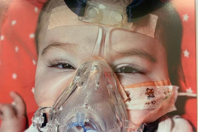 Baby Vinnie Wright with oxygen mask on