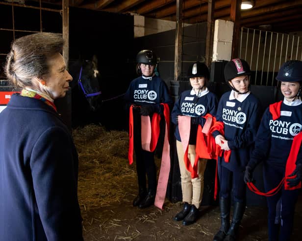 Princess Anne meets young members of the Pony Club scheme at Wrea Green Equestrian Centre.