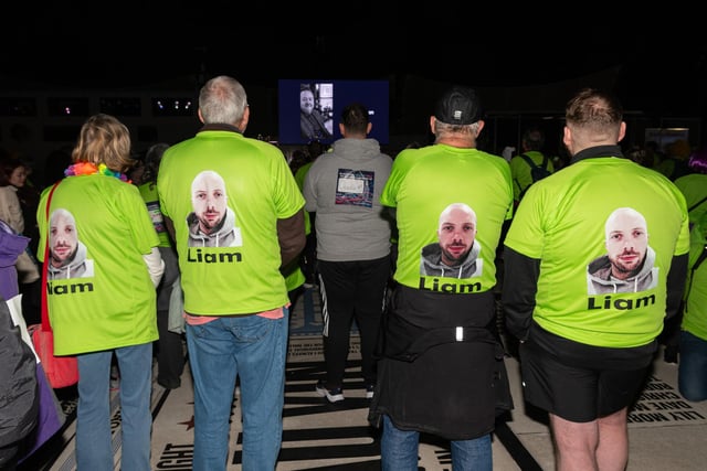 Walkers watch an emotional video on the big screen before the Memory Walk on Blackpool Promenade in aid of Trinity Hospice. Photo: Kelvin Lister-Stuttard