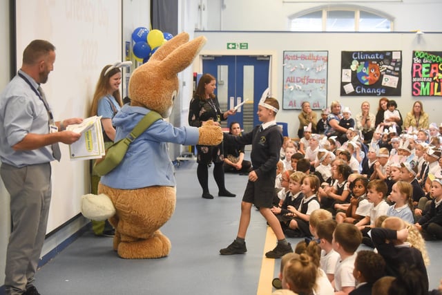 One of the pupils goes to meet Peter Rabbit  while the rest of the class at Westminster Primary look on