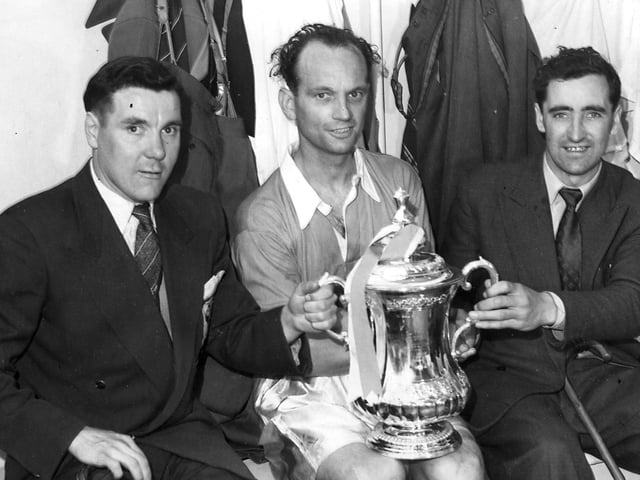 Allan Brown (left) and Hugh Kelly (right) with Harry Johnston holding the cup