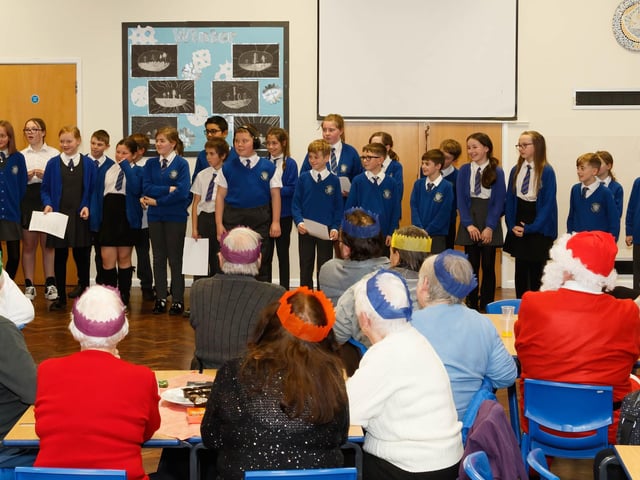 The choir sing some suitably festive pieces during the annual Christmas lunch at Manor Beach Primary School in Cleveleys