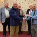Shaun Haynes presenting cheque to Dave Whitworth of Men’s Shed, Fleetwood supported by members of Saturnian Chapter