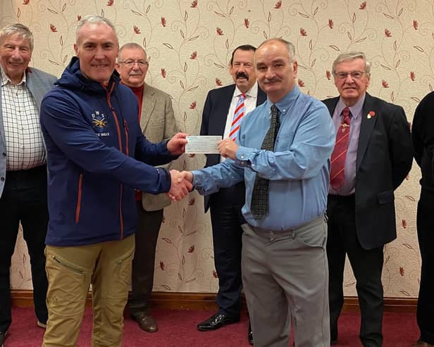 Shaun Haynes presenting cheque to Dave Whitworth of Men’s Shed, Fleetwood supported by members of Saturnian Chapter