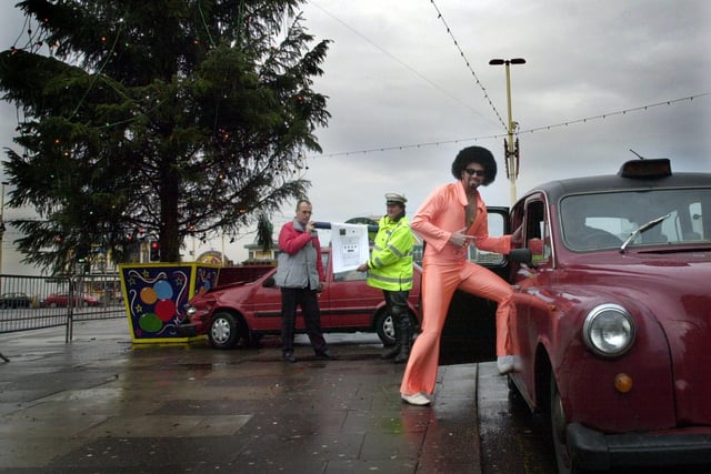 Blackpool Borough Council Group Engineer Traffic and Road Safety Ian Thompson and Western Divisional Police Road Safety Dept PC Mike Gittus with a giant alcometer, while Lionel Vinyl takes the safe option at the launch of a road safety initiative