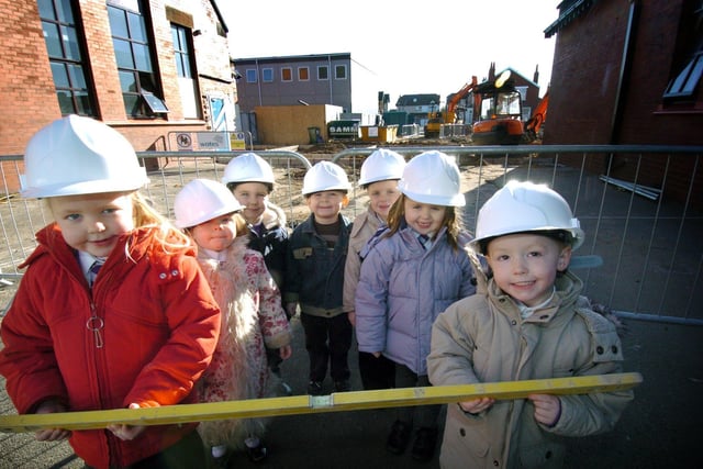 Pupils from the nursery and reception classes at Thames Primary School inspect the building work on the new children's centre. L-R Alicia, Alesha, Matthew, Anthony, Michael, Georgia and Harvey