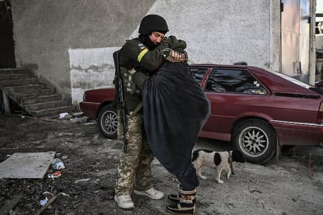 A Ukrainian soldier hugs his wife