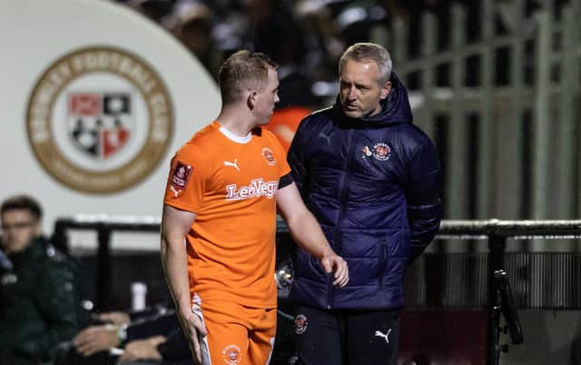 Shayne Lavery speaks with Neil Critchley after being substituted against Bromley. He is to miss the FA Cup tie with Forest Green Rovers. (Photographer Andrew Kearns / CameraSport)