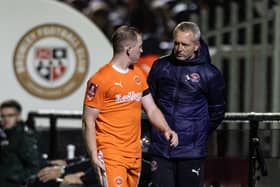 Shayne Lavery speaks with Neil Critchley after being substituted against Bromley. He is to miss the FA Cup tie with Forest Green Rovers. (Photographer Andrew Kearns / CameraSport)