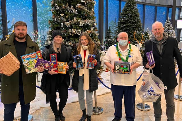 Striking postal workers deliver presents for sick children. Photoed - Chris, Portia, Maddie and Carl with Haematology HCA Martin Gillan at Blackpool Victoria Hospital.