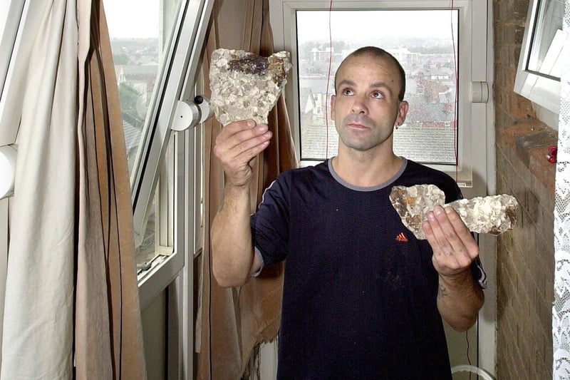 David Knight with pieces that fell from the ceiling of his flat at Ashworth Court, Queens Park in 2001