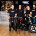 Bowker Motorrad staff and with the Ian Fletcher and the customised bike at the Waterloo Bar 