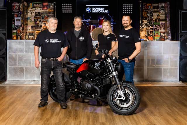 Bowker Motorrad staff and with the Ian Fletcher and the customised bike at the Waterloo Bar 