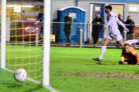 Joe Rowley scores AFC Fylde's winning goal at King's Lynn Town   Picture: STEVE MCLELLAN