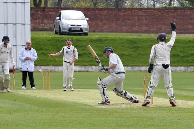Blackpool's Arran Lewin takes the wicket of Leyland captain James Rounding Picture: NEIL CROSS