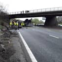 Dramatic photographs show the aftermath of a horror motorway crash which has left a lorry split in half.