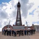 A picture of the Forbes Legal Aid team from Blackpool outside the iconic tower.