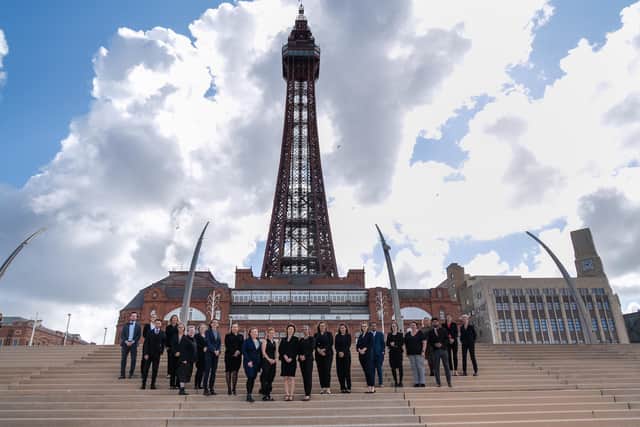 A picture of the Forbes Legal Aid team from Blackpool outside the iconic tower.