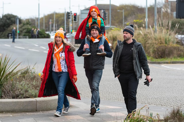 Blackpool fans arrive at Bloomfield Road ahead of the Championship fixture against Burnley. Photo: Kelvin Stuttard