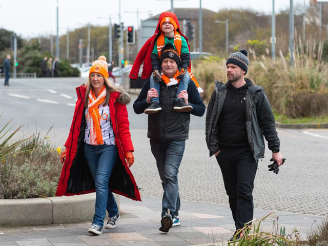 Blackpool fans arrive at Bloomfield Road ahead of the Championship fixture against Burnley. Photo: Kelvin Stuttard