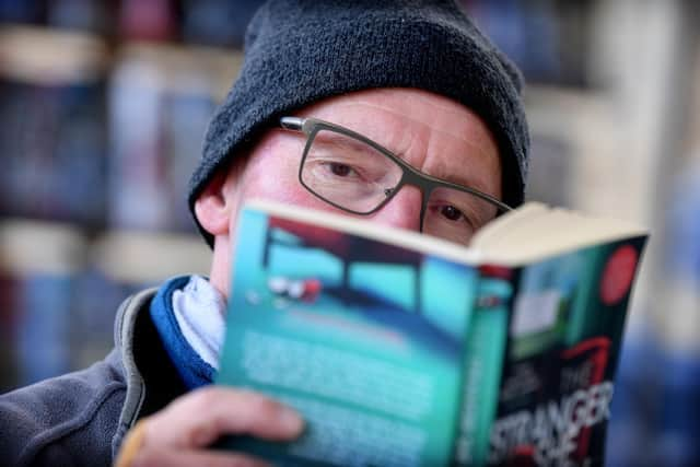 Derek Walsh on Derek's Books stall, Preston Market