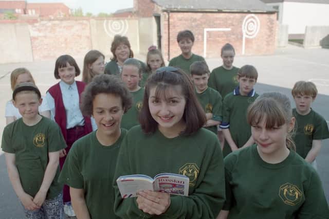 Rebecca Robson, 15, Emma Worthington, 11 (left), and Mary Clifford, 11, with fellow members of the Chi Rho Youth Club, Wesham, looking forward to a visit from children from Chernobyl