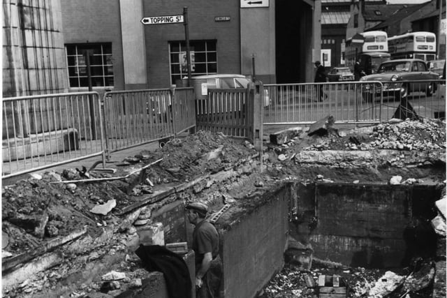 This was the corner of King Street and Deansgate and shows the hole in the road after the removal of the weighbridge outside St John's market