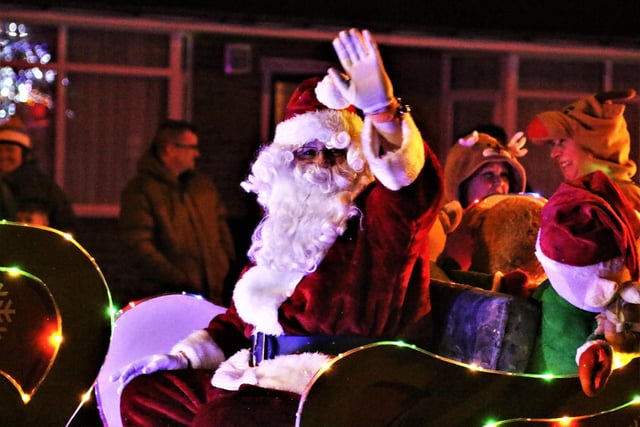 A wave from Santa on his parade through Bispham.