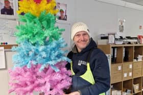 Mark Tyson, delivery driver at Wiltshire Farm Foods, wearing his knitted hat from a customer.