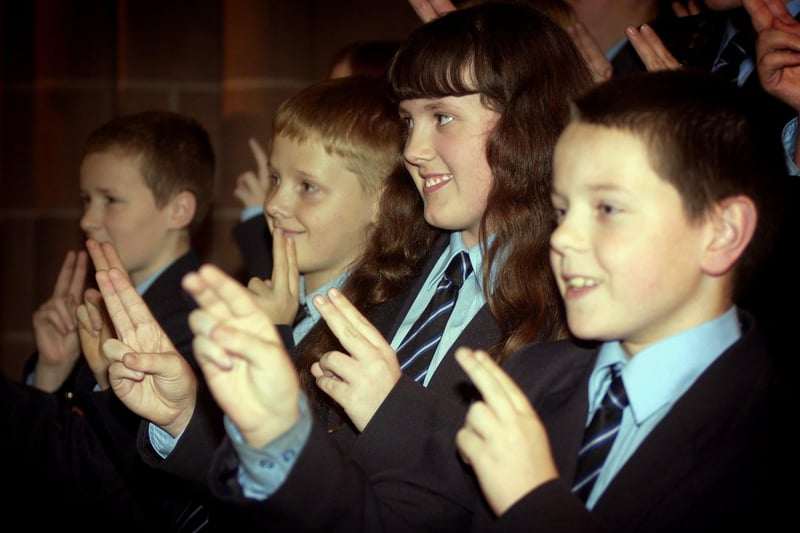 Children from Collegiate High School performing their Cristmas Carol concert in sign language at St Mark's Church in Layton