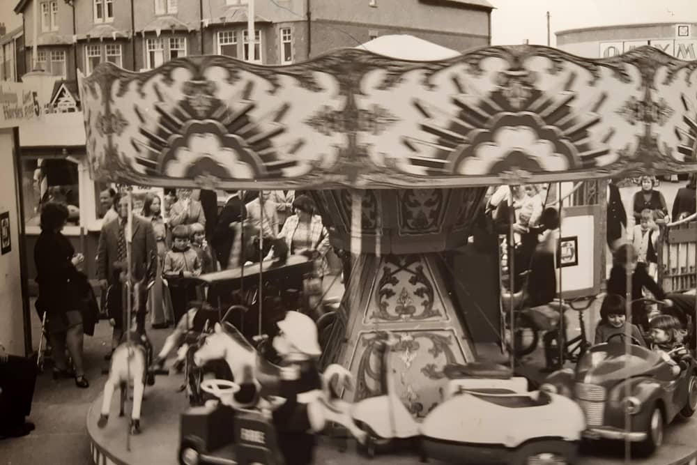 This scene shows the children's fairground opposite Olympia, Kiddies Corner. It is undated but probably mid-1980s