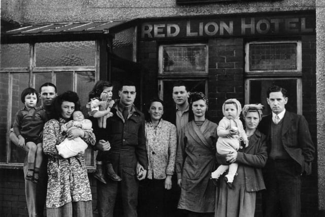 Squatters move into the old Red Lion Hotel, Bispham. Four Ex-Servicemen and their families took possession of the hotel, they are l-r:- Mr and Mrs W. Ratcliffe and their two children Doreen (3) and baby Jean . Mr and Mrs S.H. Sharp and their daughter Diane (2). Mr and Mrs K. Cull and Mr and Mrs H. Proudlock and their daughter Marie Rhonda, 1946
